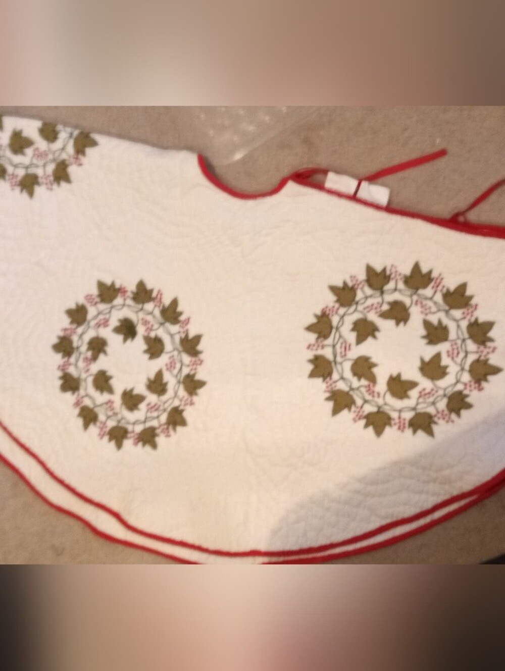 White Quilted Tree Skirt with Olive Leaf Wreaths and Red Trim